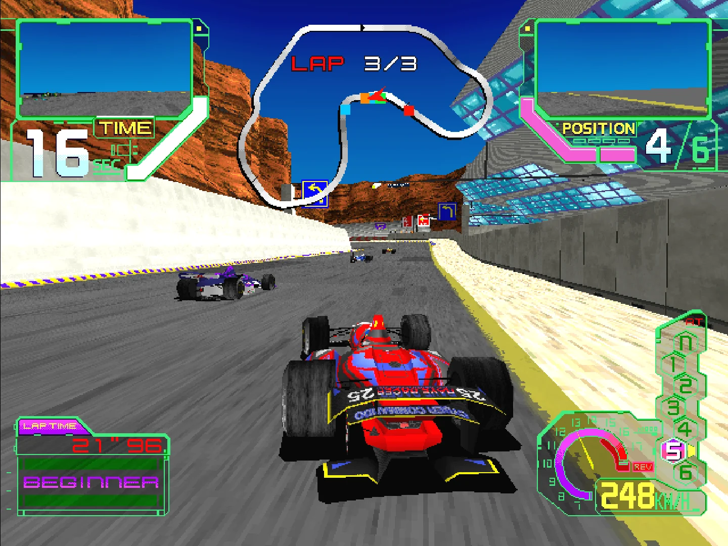 Capture d'Ace Driver Victory Lap : une monoplace rouge vue de l'arrière dans un virage, entre un mur gris et une bordure jaune, avec un plan du circuit en haut de l'écran et la mention BEGINNER