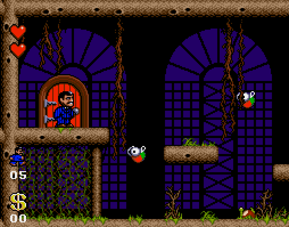 Capture : Gomez devant une porte, sur une plateforme de bois, au milieu de lianes, devant de grandes fenêtres en arc bleu nuit