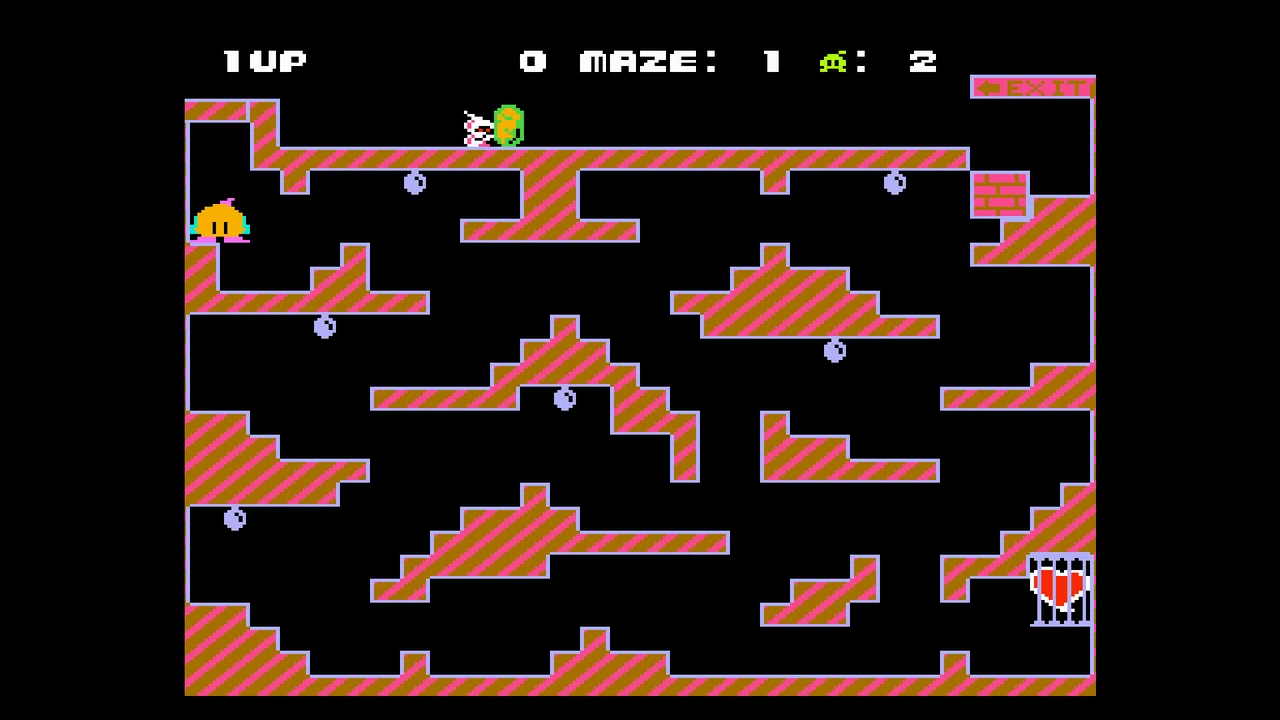 Capture de Chack'n Pop : un labyrinthe aux murs rayés roses, Chack'n en haut à gauche et un cœur en cage en bas à droite