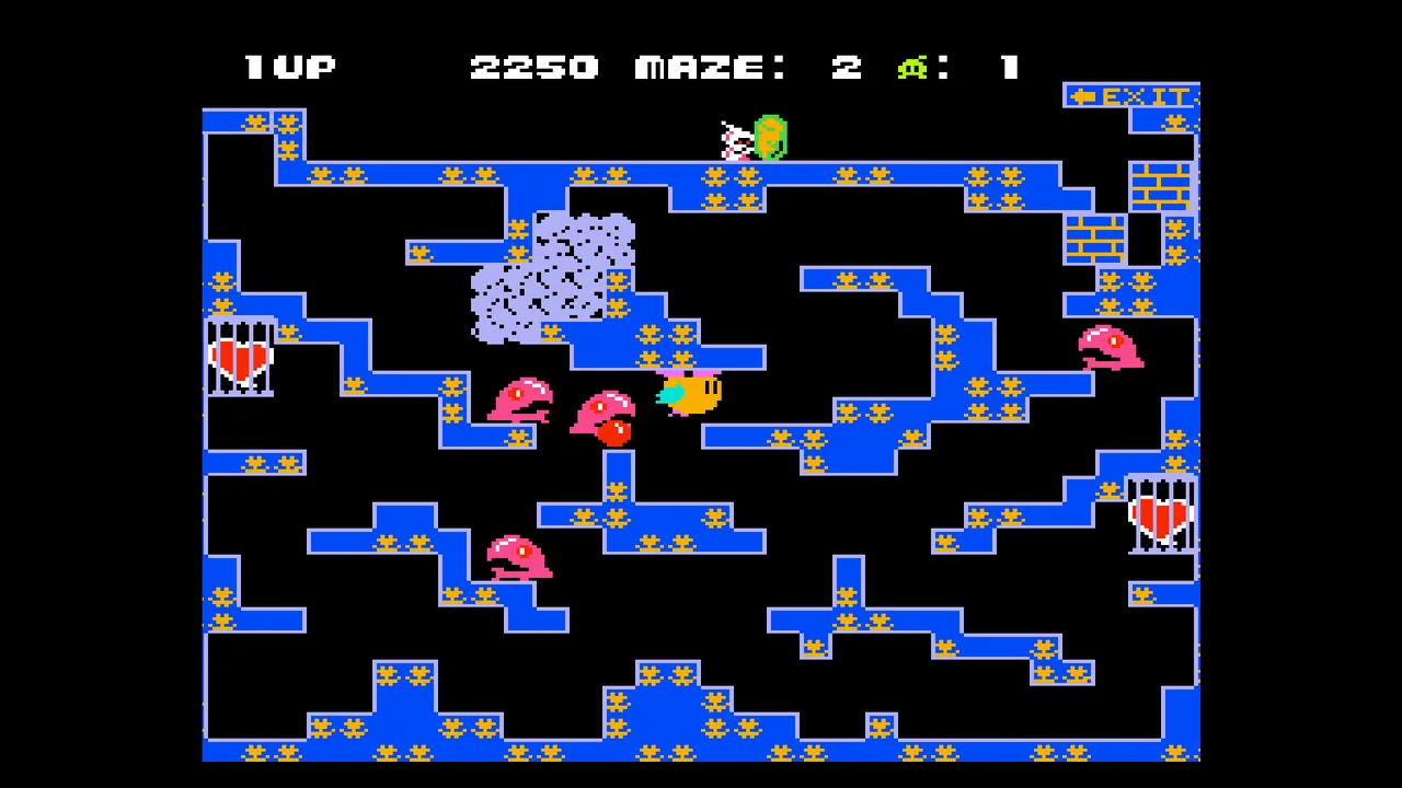 Capture de Chack'n Pop : un labyrinthe bleu peuplé de monstres roses, deux cœurs en cage sur les côtés