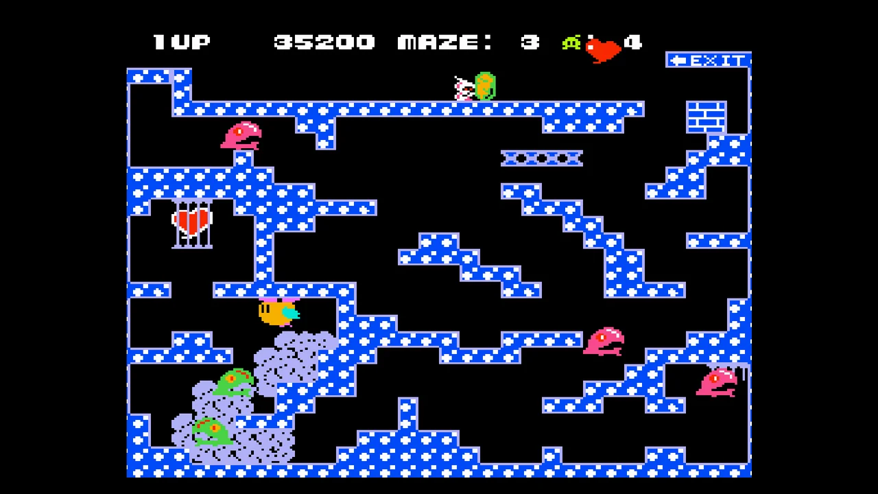Capture de Chack'n Pop : un labyrinthe à pois bleus et blancs, avec des monstres roses et verts et un cœur en cage