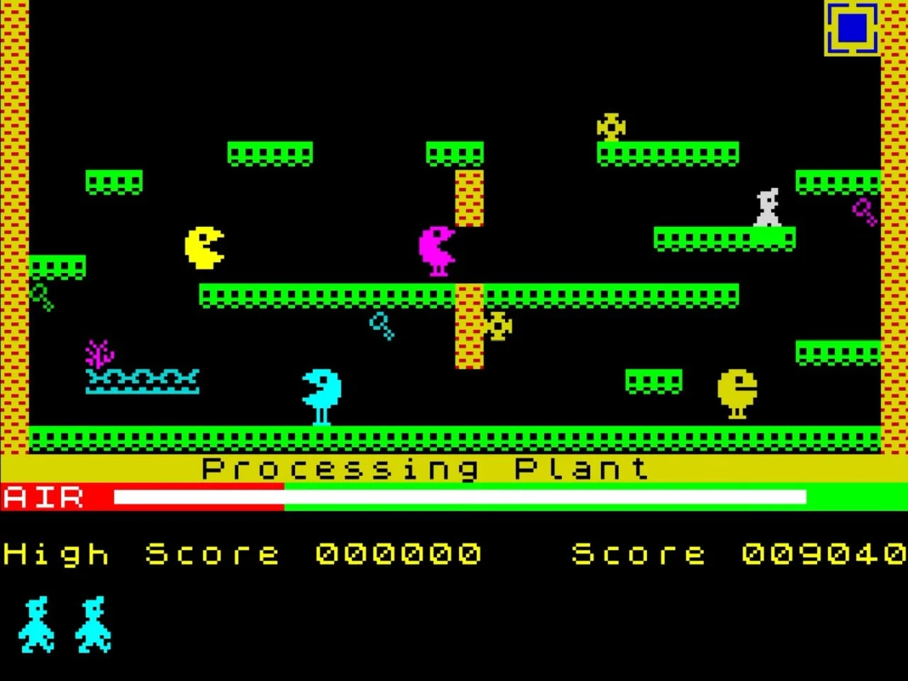 Capture du jeu original Manic Miner sur ZX Spectrum : Miner Willy explore la caverne « Processing Plant », entouré de créatures colorées, avec la jauge d'air verte sur ses deux premiers tiers et rouge sur le dernier tiers, en bas de l'écran