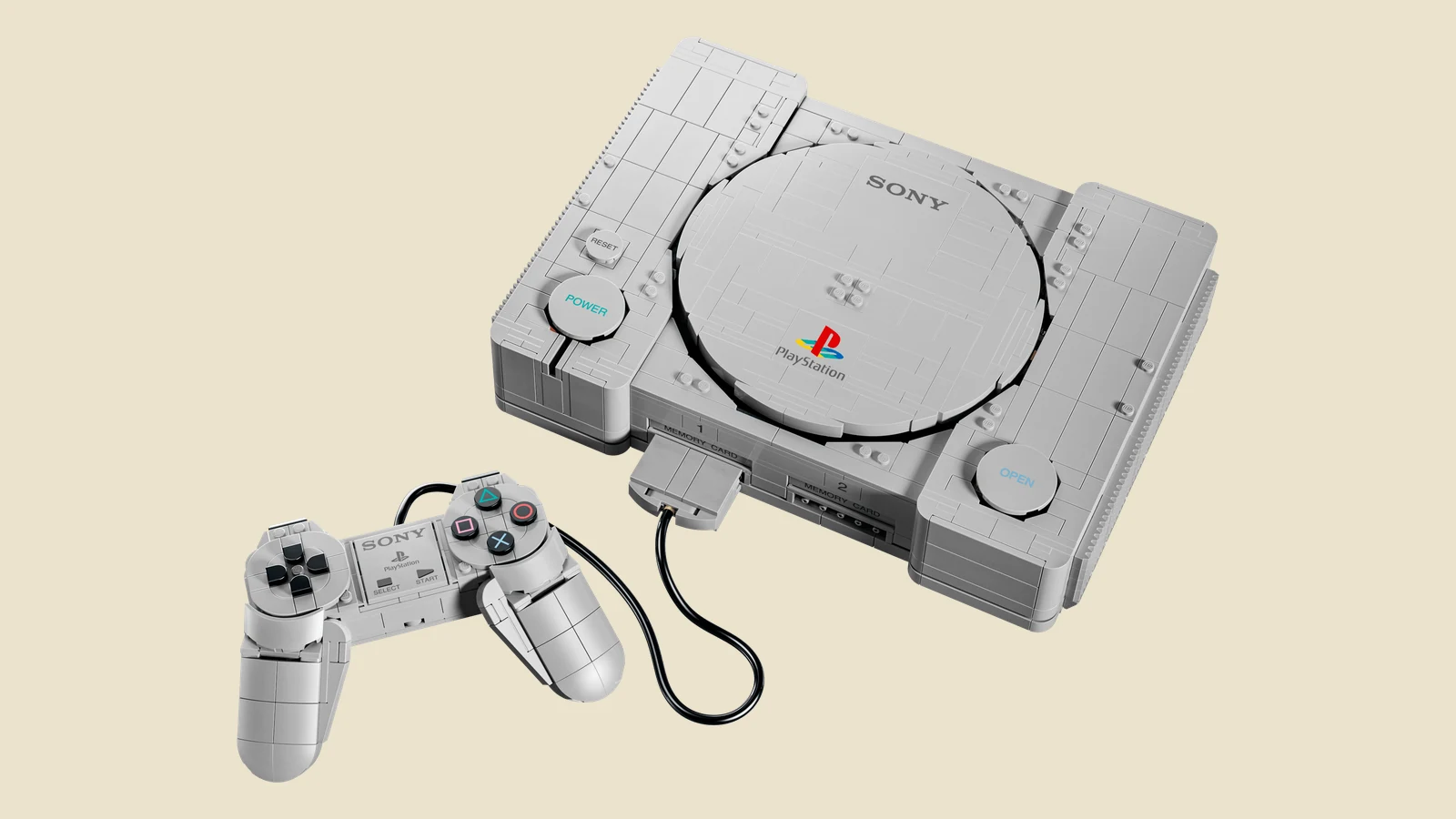 Le set LEGO PlayStation 72306 monté : la console grise, sa manette et une carte mémoire, entièrement en briques