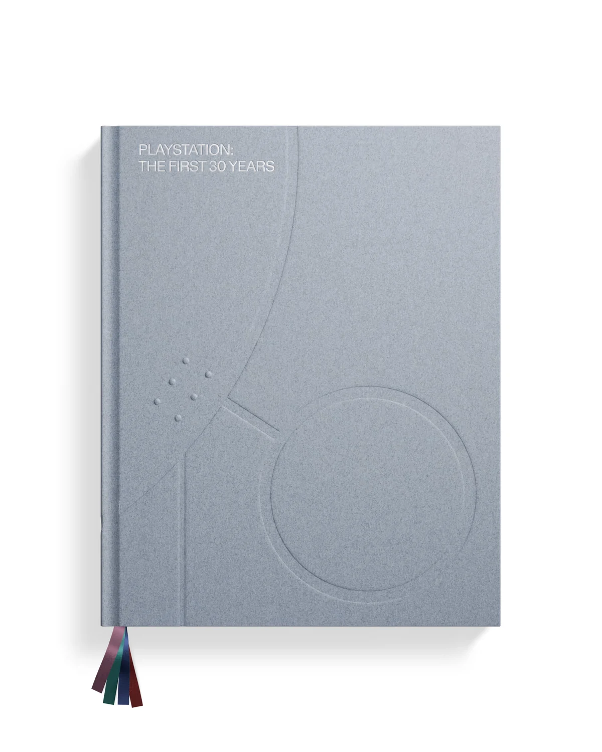 Couverture du livre PlayStation: The First 30 Years : un volume gris argenté aux motifs gravés en relief (arcs, cercle, points), avec des signets de couleur qui dépassent en bas