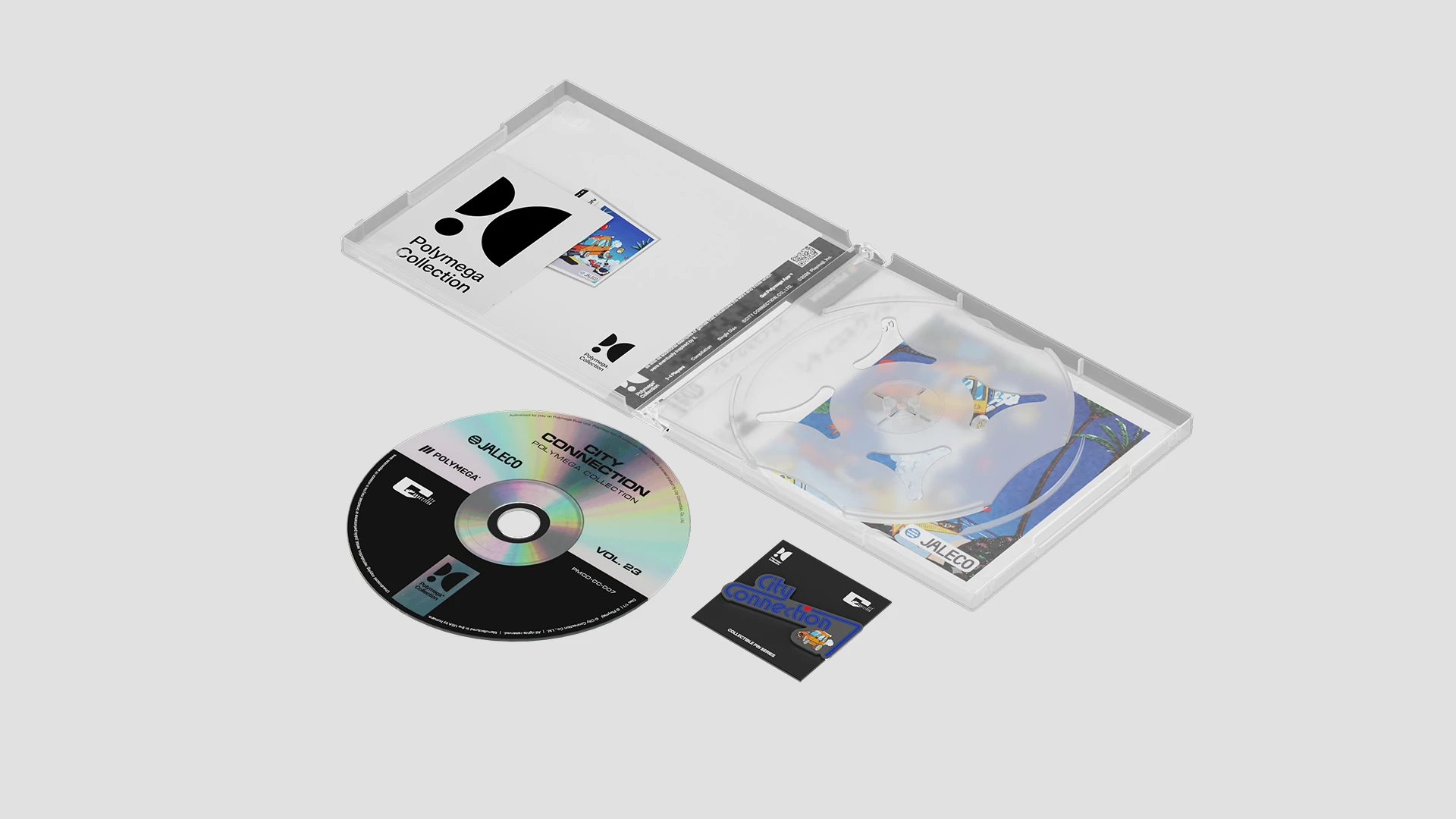 Contenu du volume 23 : un boîtier ouvert, un disque noir et argent, un encart et un pin's City Connection sur son carton, sur fond gris