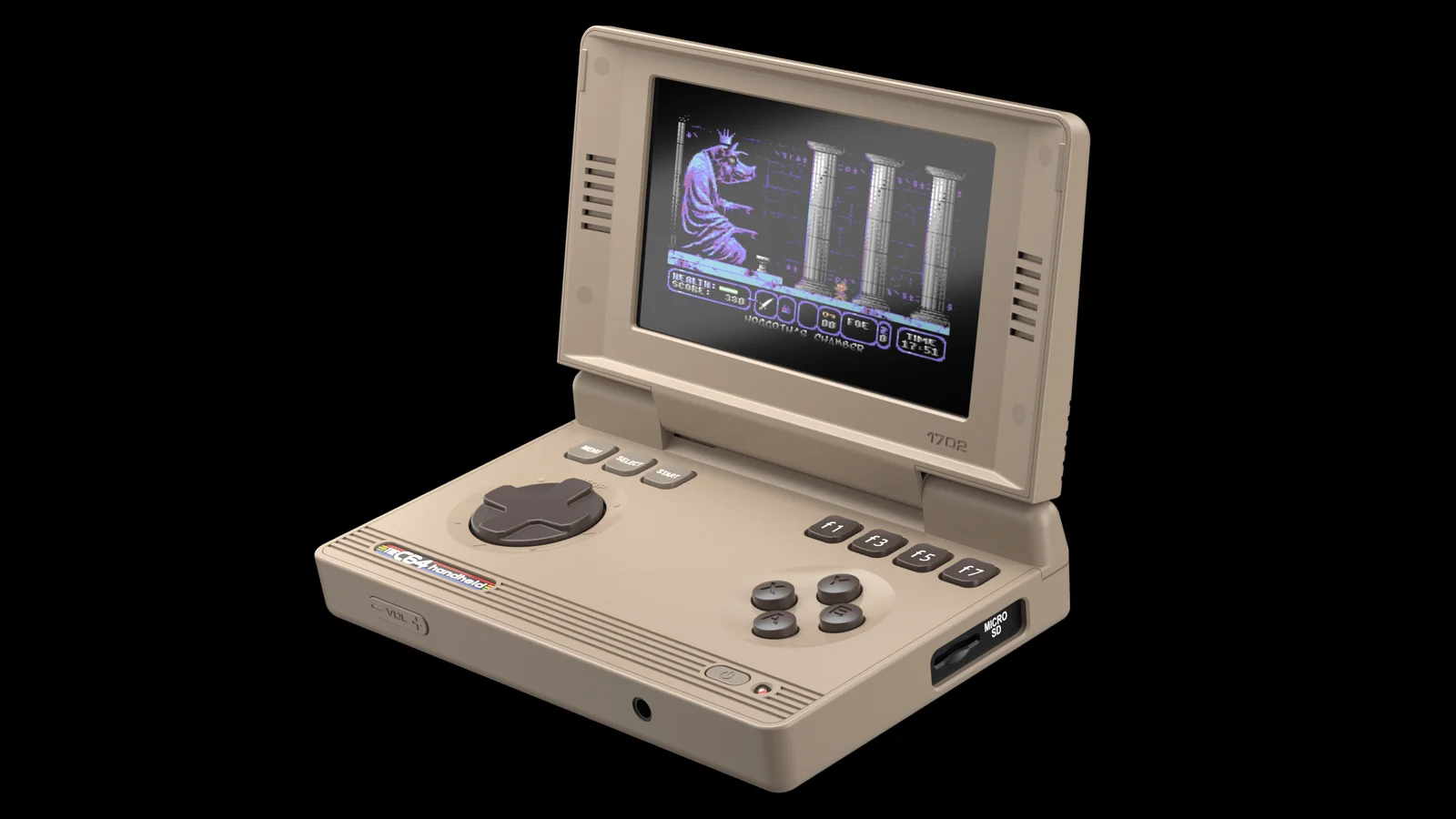 Visuel officiel : la console beige THEC64 Handheld ouverte, vue de trois quarts sur fond noir, avec sa croix directionnelle, ses quatre boutons, ses touches f1 à f7 et une fente MicroSD sur le côté. L'écran affiche une scène de jeu avec une créature assise et des colonnes