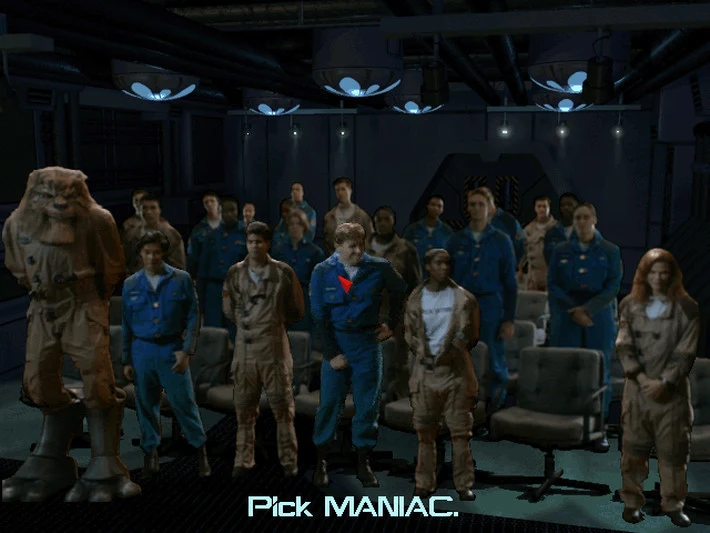 Capture de Wing Commander III : une salle de briefing filmée, des pilotes en combinaison debout entre des sièges, un personnage au visage félin à gauche, avec le sous-titre « Pick MANIAC. »