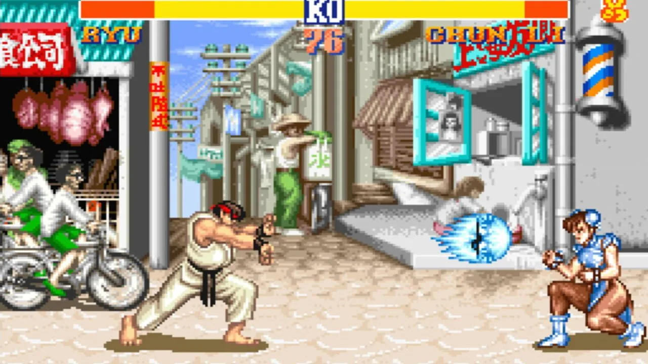Capture de Street Fighter II : Ryu projette un hadoken sur Chun-Li
