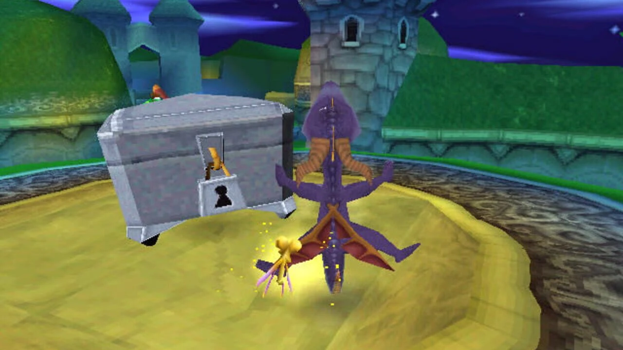 Spyro survole un coffre verrouillé devant un château, la nuit, dans Spyro the Dragon sur PlayStation